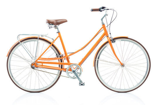 Fototapeta Stylish womens orange bicycle isolated on white