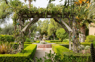 Fototapeta premium Old traditional garden with pathways and fountain
