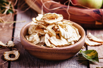 Apple chips, still life in rustic style, vintage wooden backgrou