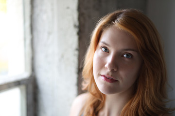 Fototapeta premium Beautiful Young Woman with Blue Eyes