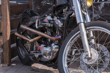 Obraz premium Motorcycle engine close-up. Chrome, shiny parts, wheels, exhaust.