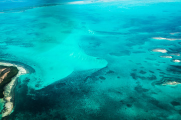 Coral reefs and turquoise waters from a plane (Los Roques, Venezuela)