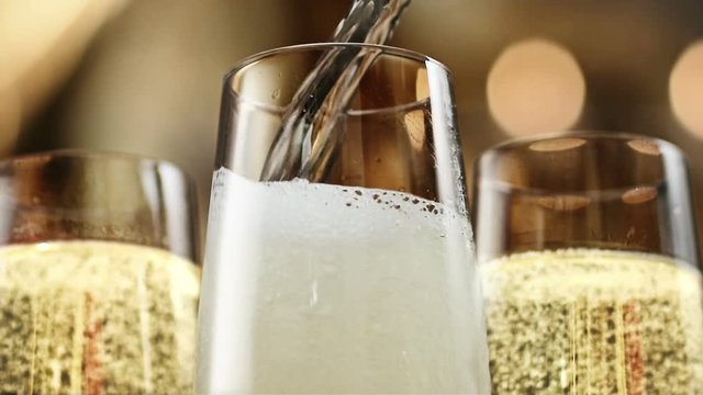 FEW SHOTS! Opening a champagne. New Year's party pouring champagne. Lighting candle.