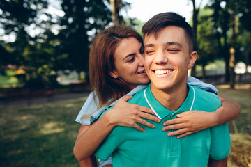 man carries a girl on his back