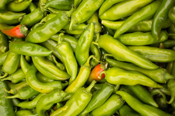Green chili peppers background