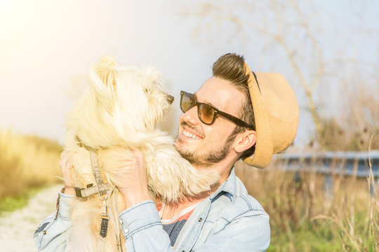 Man playing with his dog outdoor