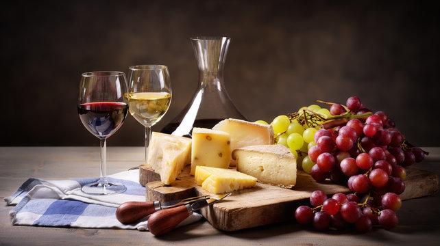 Wine, grapes and cheese platter, space for text.