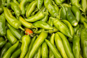 Green chili peppers background