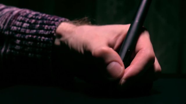 Left-handed artist working with drawing tablet for computer. 4K close up video