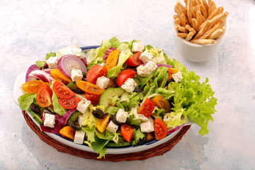 Greek salad with feta cheese black olives and crostini sticks