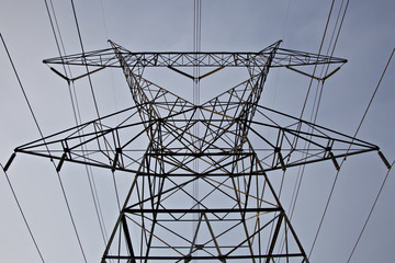 Low angle view of extremely tall electircal tower and power lines
