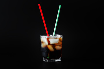 soft drinks. Cola glass with ice cubes on a white background
