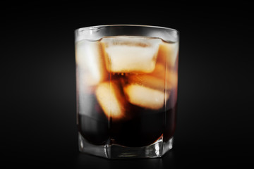 soft drinks. Cola glass with ice cubes on a white background