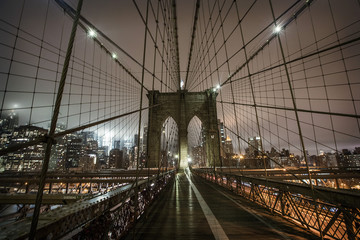 Brooklyn Bridge during a foggy night in New York