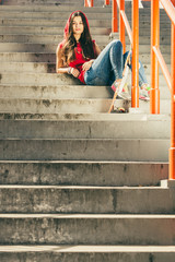 Obraz na płótnie Canvas Skate girl on stairs with skateboard.