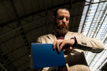 Handome businessman checking the Time