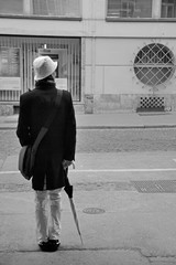 guy standing w umbrella bw