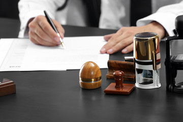 Stamps and ink pad on notary table