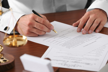 Notary public in office signing document