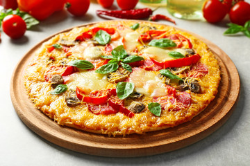 Tasty pizza with ingredients on table