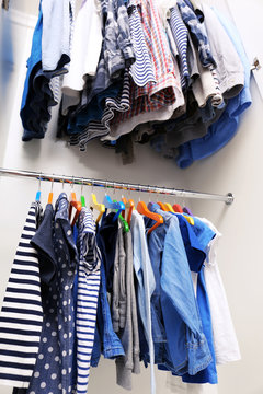 Clothes hanging on rack, closeup