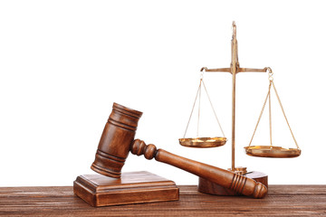 Judge's gavel and scales on white background