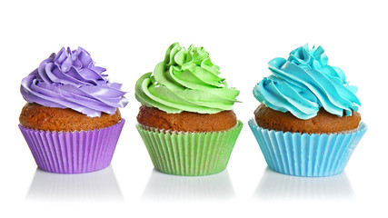 Fresh tasty cupcakes isolated on white