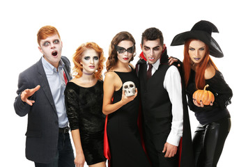 Young people dressed in different costumes for Halloween, isolated on white