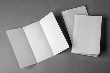 Blank brochures and booklet on grey background