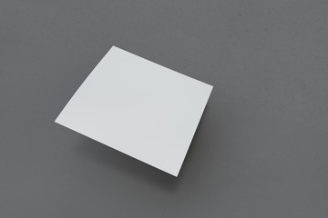 Mock-up cover a square shape on a background. Business cards, postcards and posters. Layout for your design. Three-dimensional rendering.