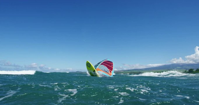 Windsurfer gets big air jumping off wave, Extreme sport