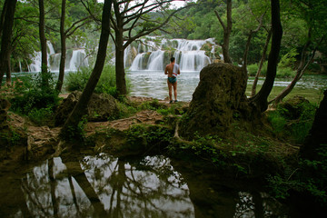 man viewing waterfall