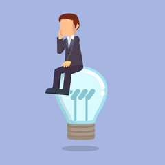 businessman sitting on bulb