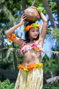 hawaii hula dancer with coconut in the tropical jungle