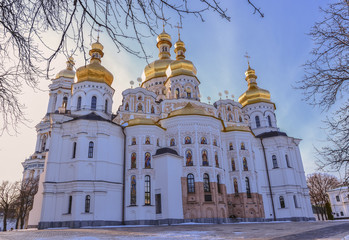 Fototapeta na wymiar Dormition Cathedral of Kiev Pechersk Lavra Monastery and Great Lavra Bell Tower in winter