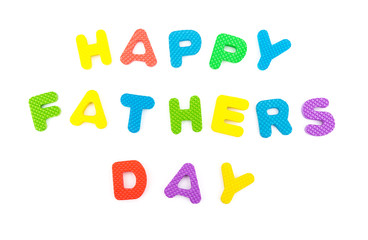 words of happy fathers day shaped by alphabet jigsaw puzzle on white