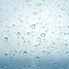 Close-up of water drops on glass surface as background