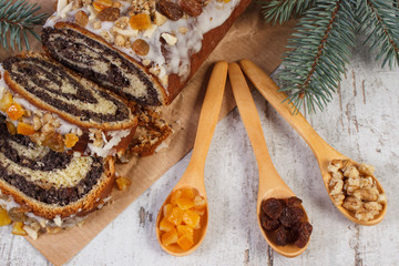 Poppy seeds cake with ingredients for baking and spruce branches, dessert for Christmas