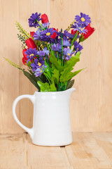 Beautiful  flower bouquet on wooden table