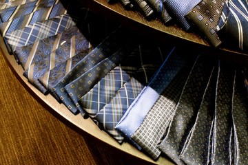 Obraz na płótnie Canvas Blue Ties / Blue Neckties, menswear accessory, laid out on a table.
