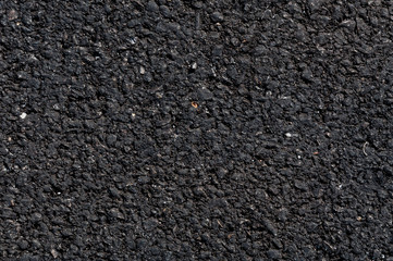 Close up of asphalt road,Black nature asphalt background,background texture of rough asphalt,macadamized texture