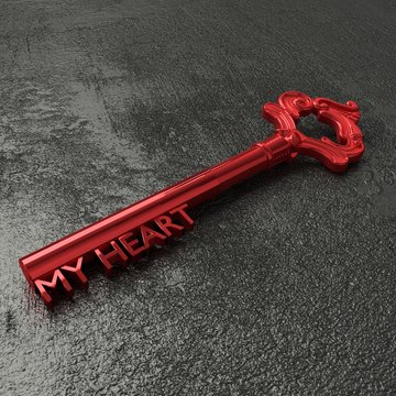Red vintage key with the words my heart on a rough black stone table 3D illustration