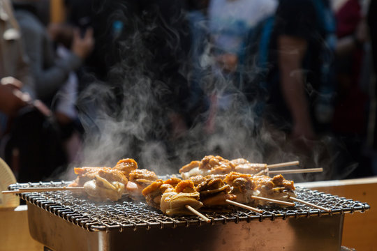 scallop (hotate) and sea ​​urchin eggs (uni) skewer grill with smoke, japan
