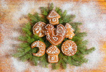 Christmas Tree on wooden background.Christmas Tree decorated with gingerbread
