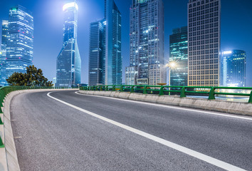 empty asphalt road through modern city in China.
