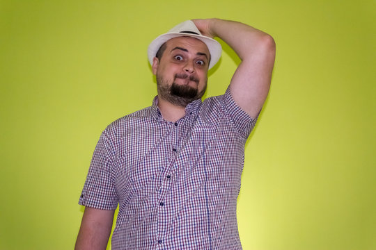 Man marveling on a green background
