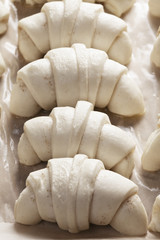 Raw of uncooked croissants