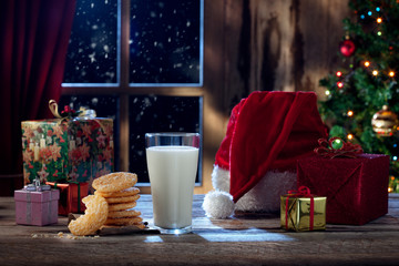 close up view of glass of milk with cookies on color back