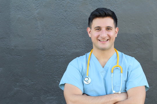 Handsome Smiling Doctor Isolated on Gray
