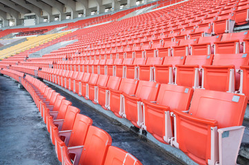 Empty orange seats at stadium,Rows of seat on a soccer stadium
